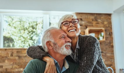 Mature woman hugging her husband