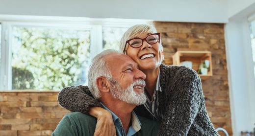 Mature woman hugging her husband