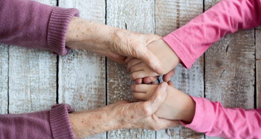 hands-of-unrecognizable-grandmother-and-her-PUBBZE4-scaled-1-1200x801
