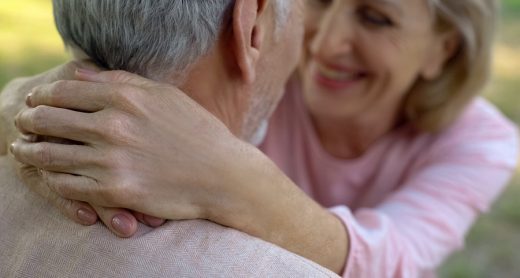 Happy old couple hugging in park, comfortable retirement, secure old age, love