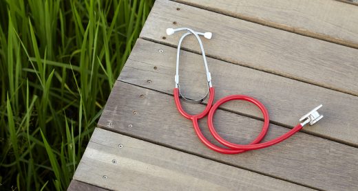 stethoscope red on wood, Concept, Doctor or medical volunteers to visit elderly people in rural Asia